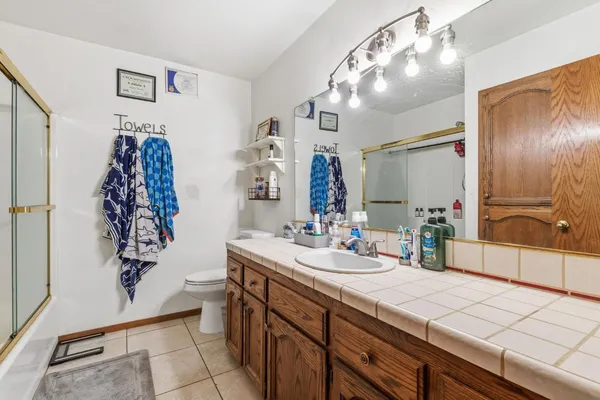 a bathroom with a shower and a sink