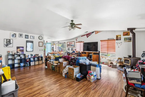 a living room with lots of furniture and a flat screen tv
