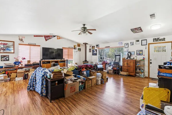 a living room with lots of furniture and a flat screen tv