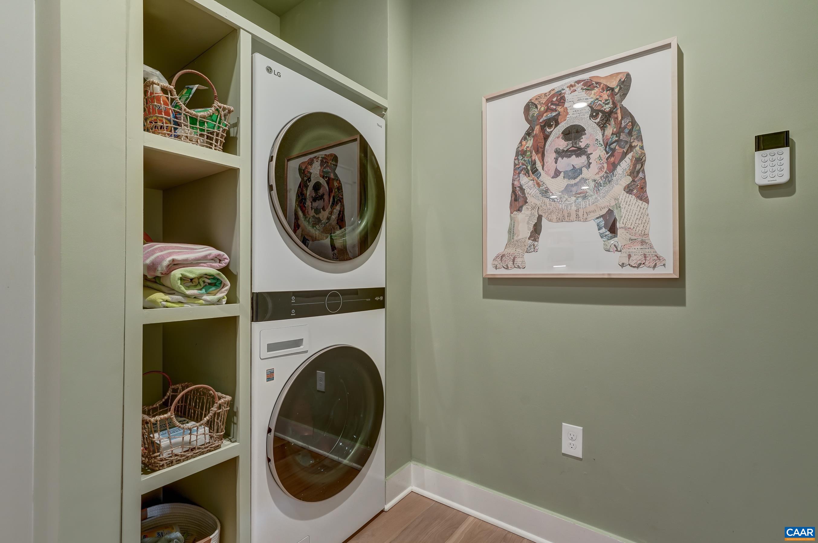 3327 Rowcross Street Crozet, VA 22932 - Photo 32 of 63 Large mudroom includes stacked LG washer and dryer, storage hooks and cubbies.
