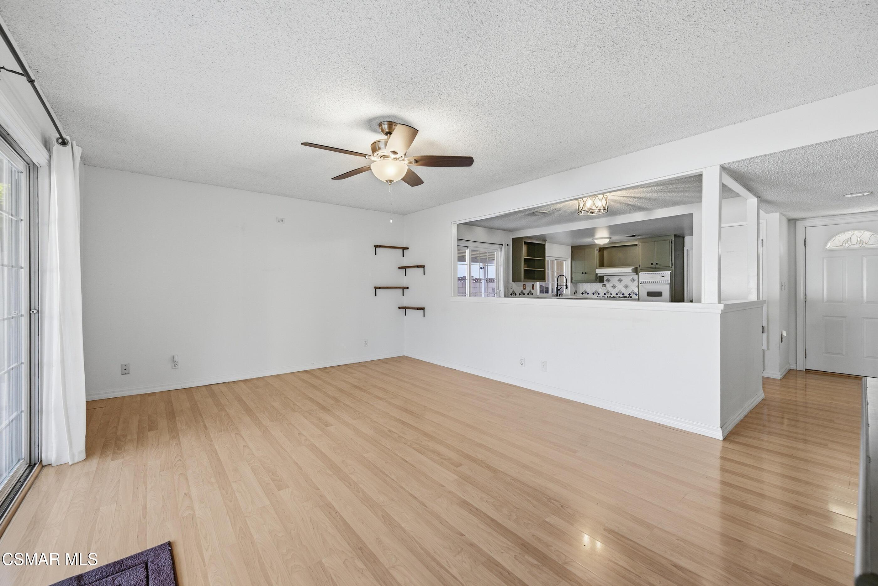 2267 Morley Street Simi Valley, CA 93065 - Photo 11 of 35 an empty room with wooden floor and windows