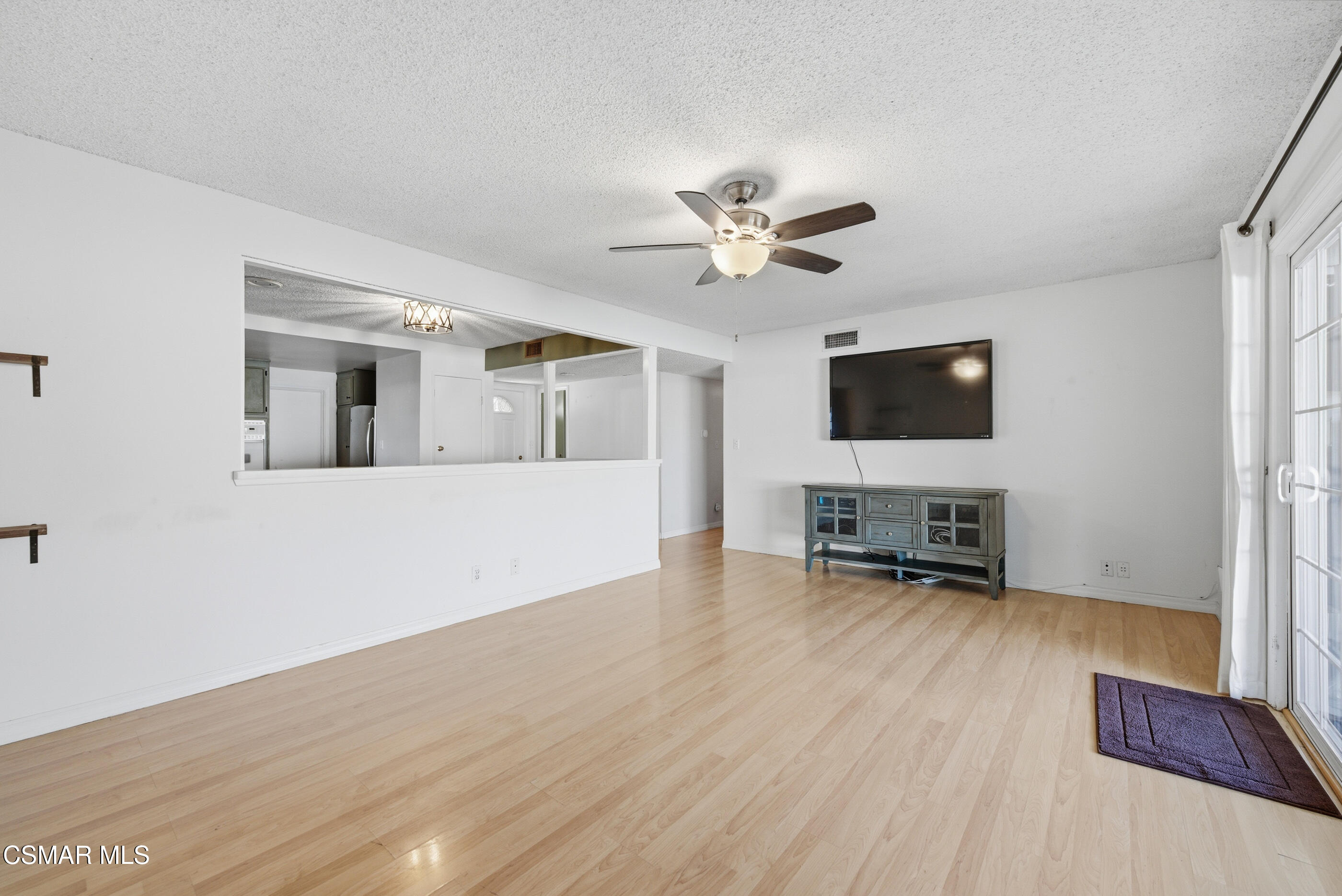 2267 Morley Street Simi Valley, CA 93065 - Photo 12 of 35 a view of a livingroom with a flat screen tv and furniture
