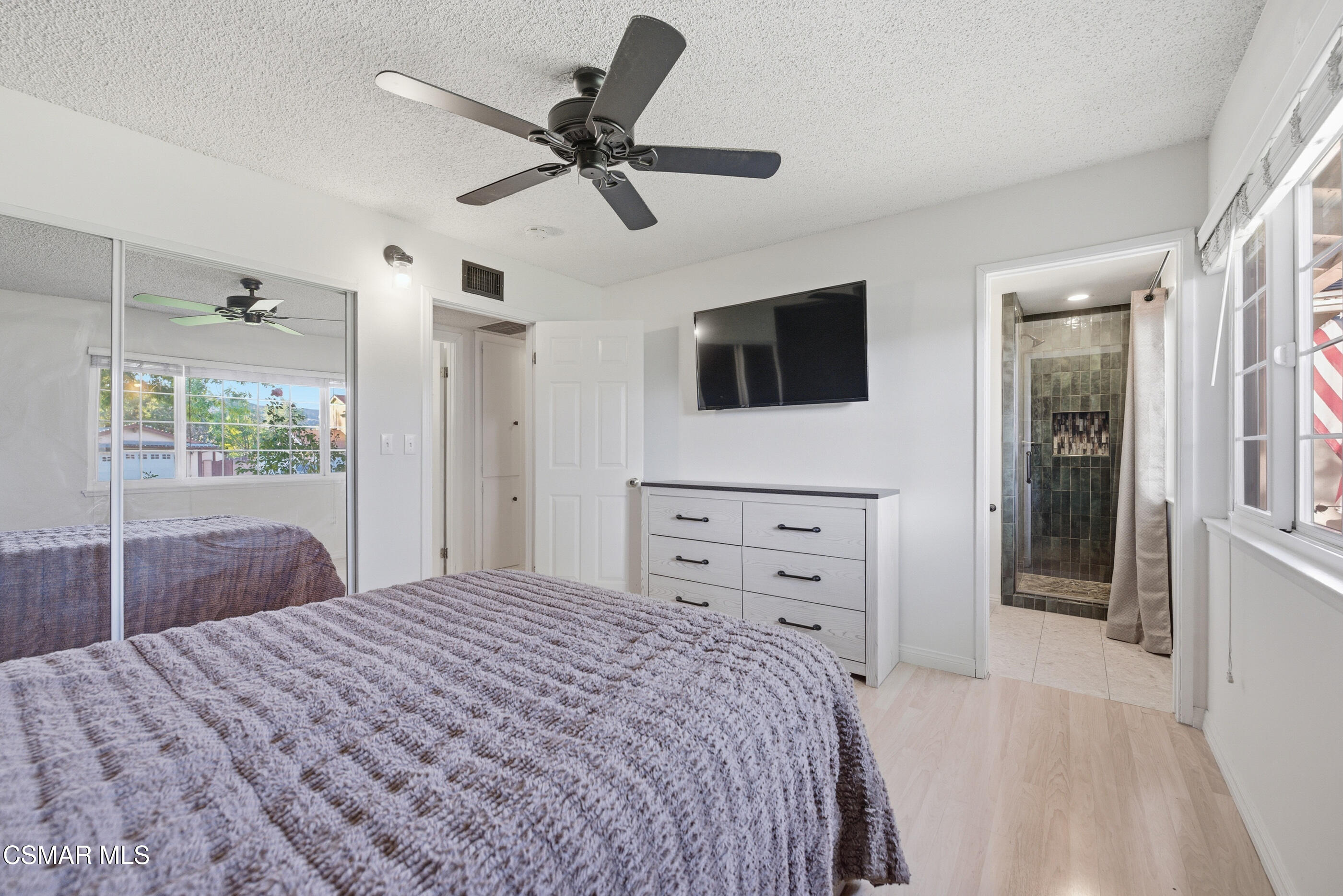 2267 Morley Street Simi Valley, CA 93065 - Photo 14 of 35 a bedroom with a bed a flat screen tv and a dresser