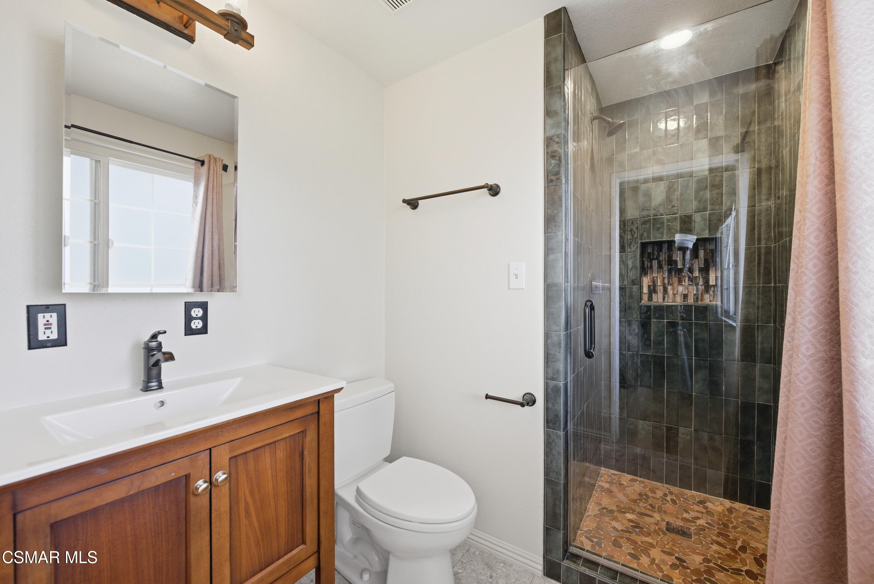 2267 Morley Street Simi Valley, CA 93065 - Photo 16 of 35 a bathroom with a toilet a sink and glass door