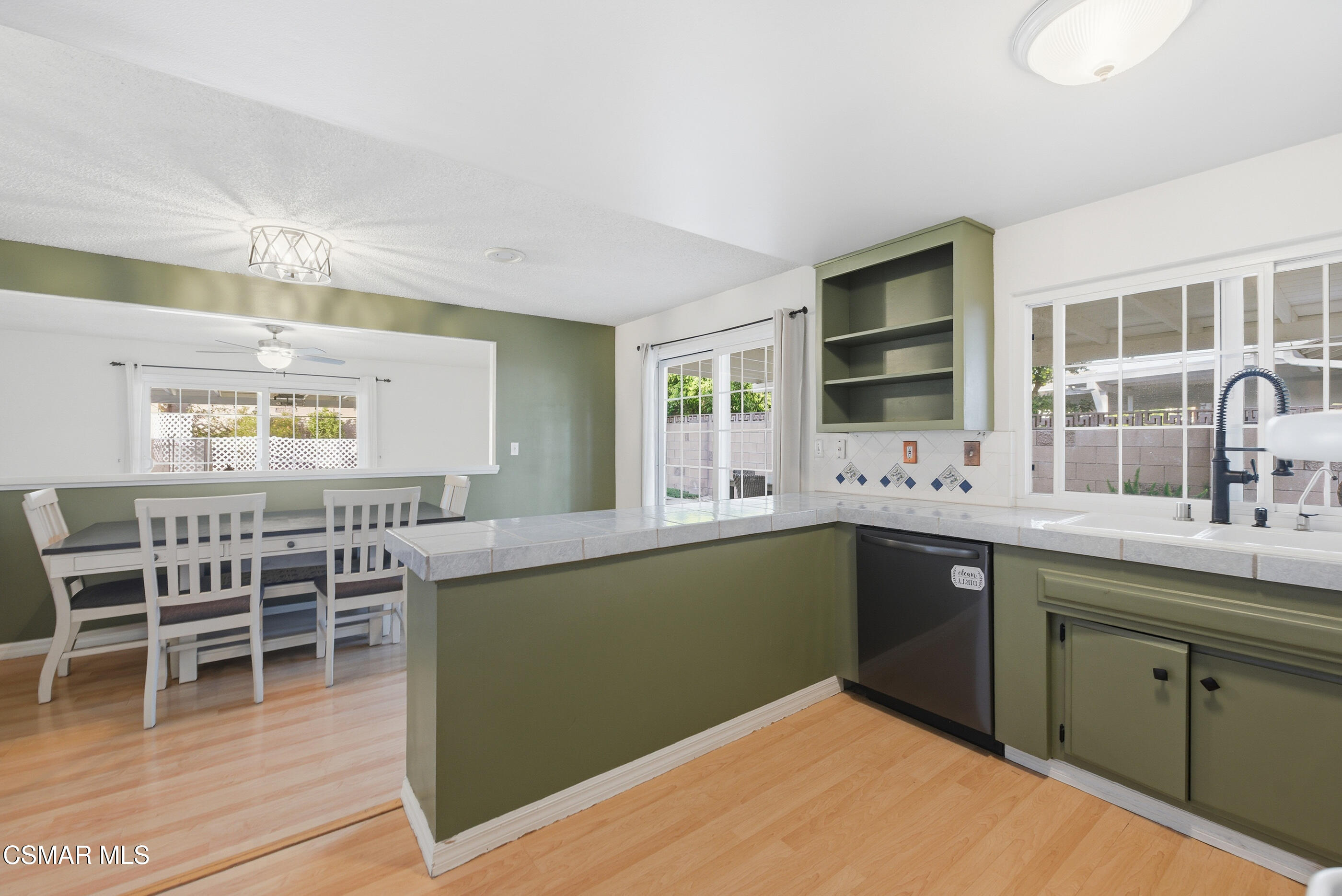 2267 Morley Street Simi Valley, CA 93065 - Photo 6 of 35 a kitchen with lots of counter top space and dining table