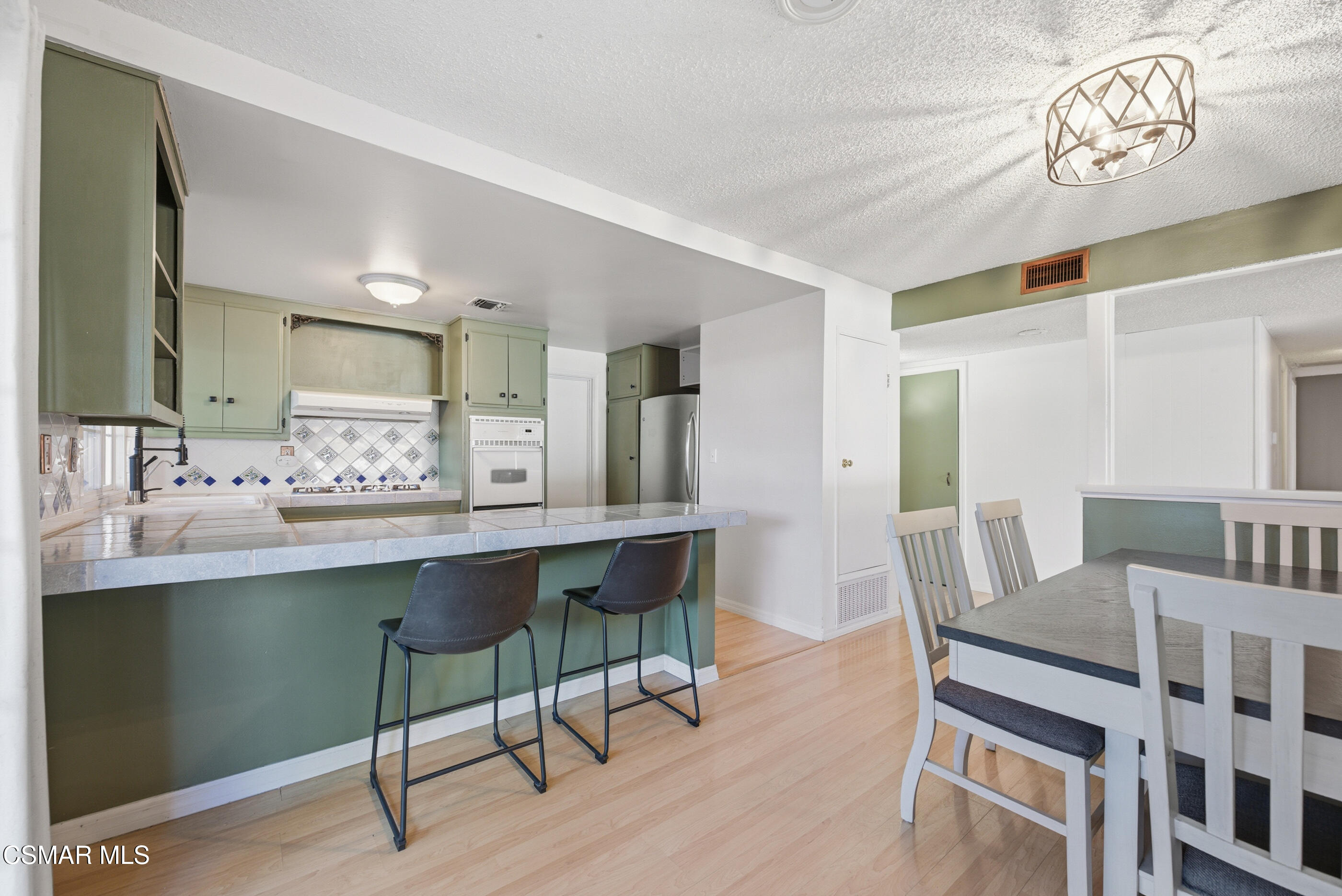 2267 Morley Street Simi Valley, CA 93065 - Photo 7 of 35 a dining room with furniture and wooden floor