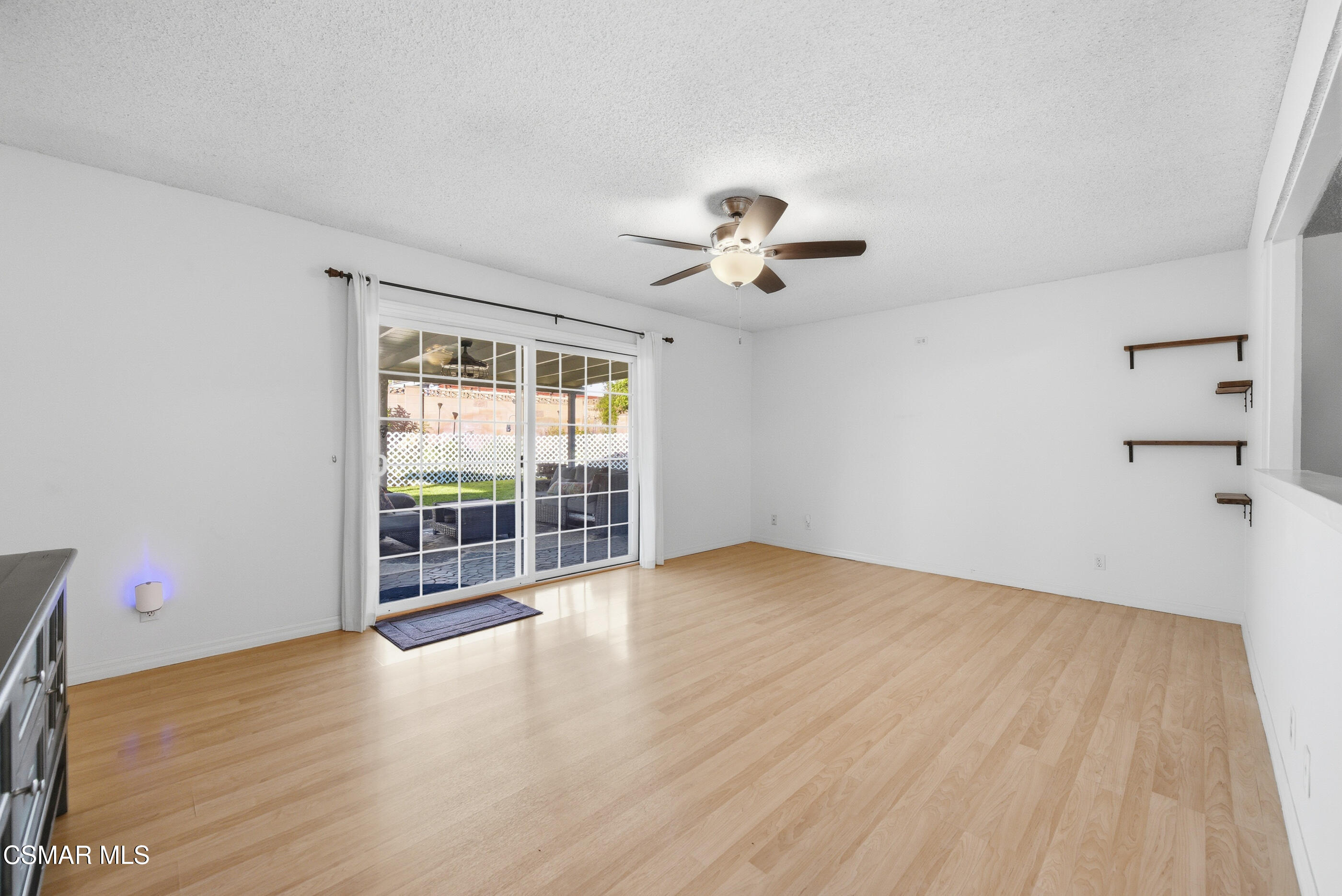 2267 Morley Street Simi Valley, CA 93065 - Photo 10 of 35 a view of an empty room with a window and wooden floor