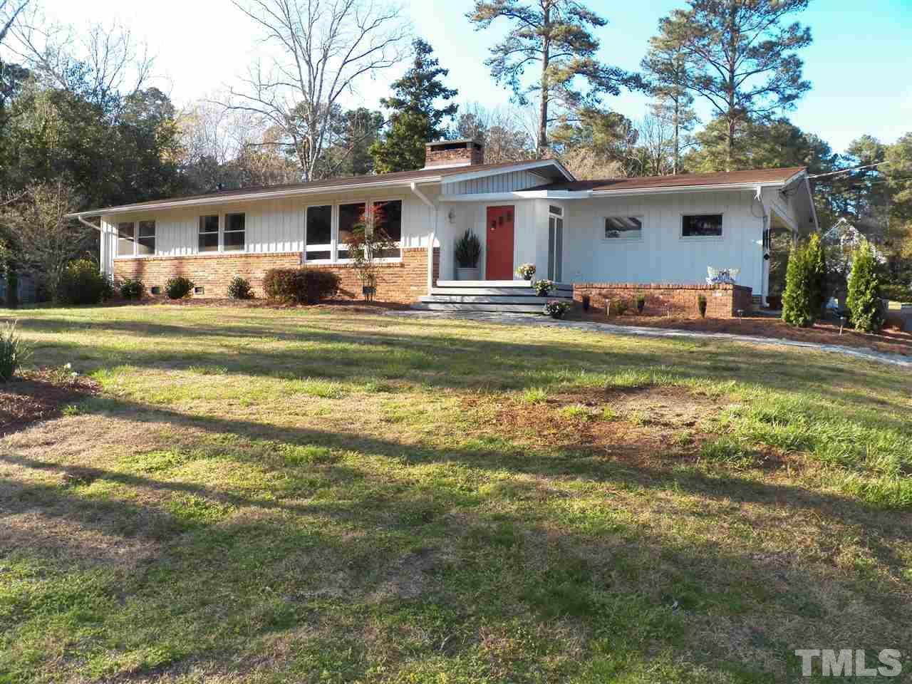212 Bayleaf Drive Raleigh, NC 27615 - Photo 1 of 25 a front view of house with yard barbeque and outdoor seating