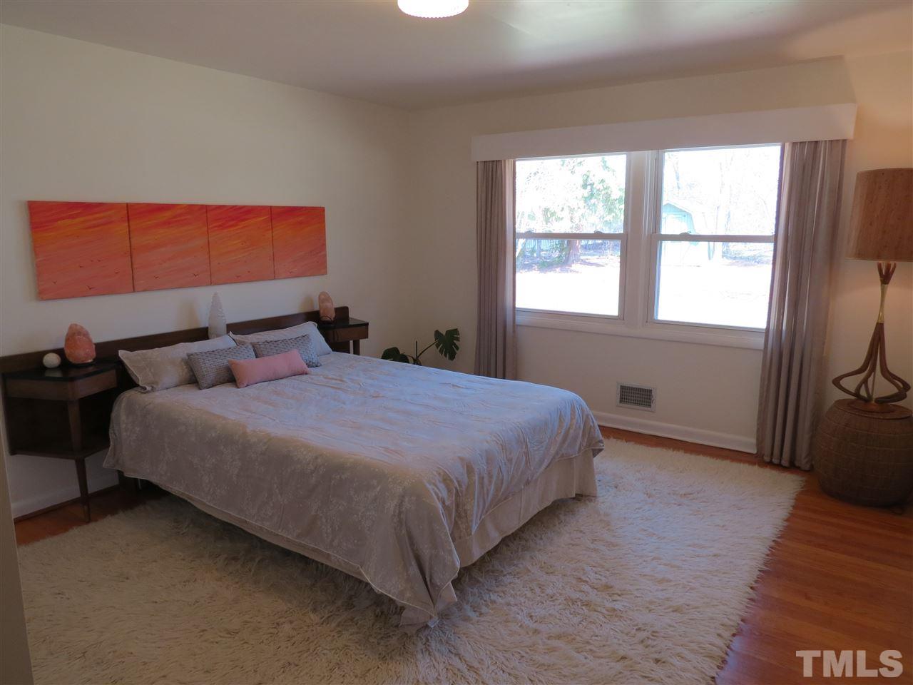 212 Bayleaf Drive Raleigh, NC 27615 - Photo 13 of 25 a bedroom with a bed and window