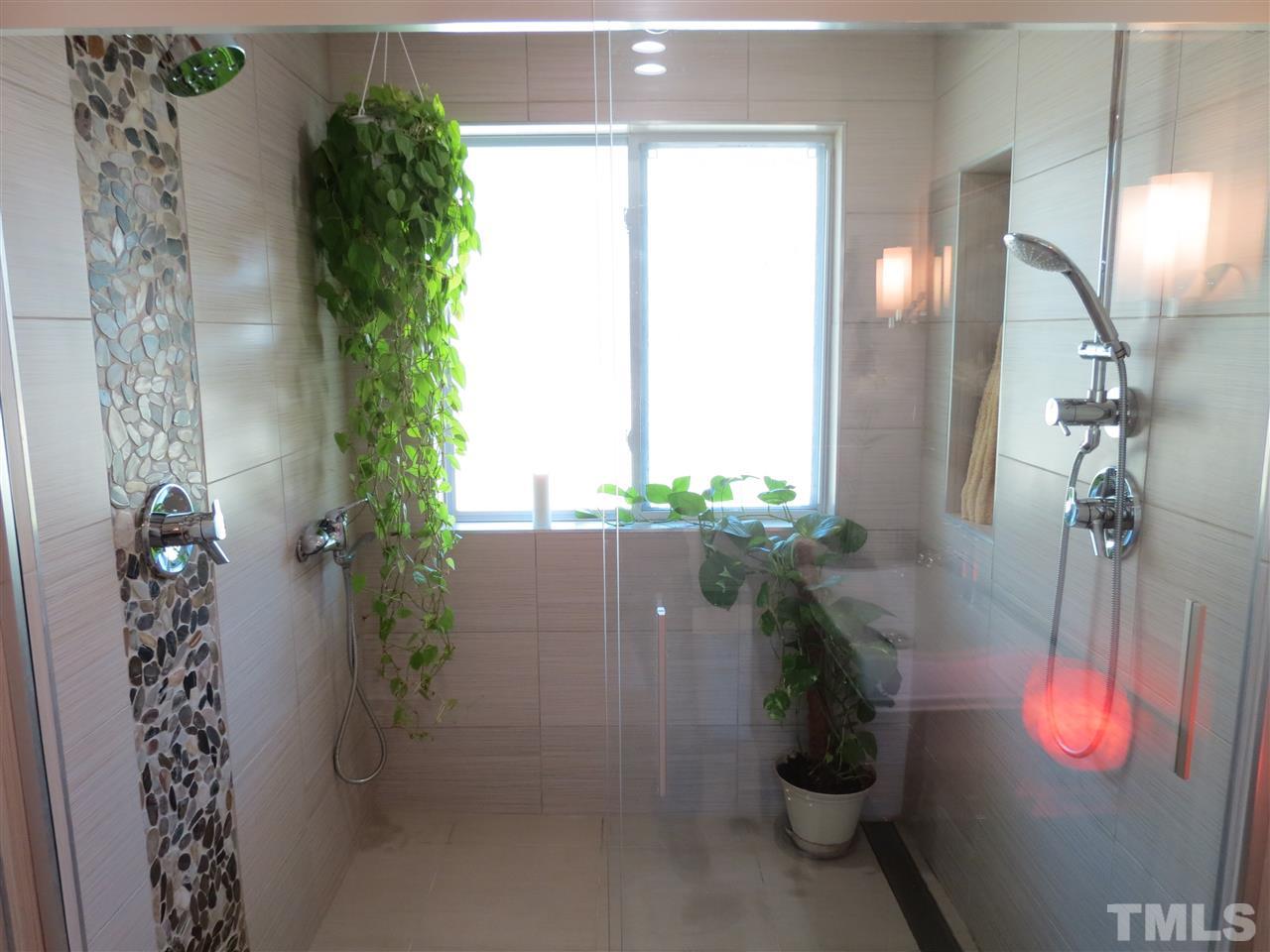 212 Bayleaf Drive Raleigh, NC 27615 - Photo 14 of 25 a bathroom with a shower