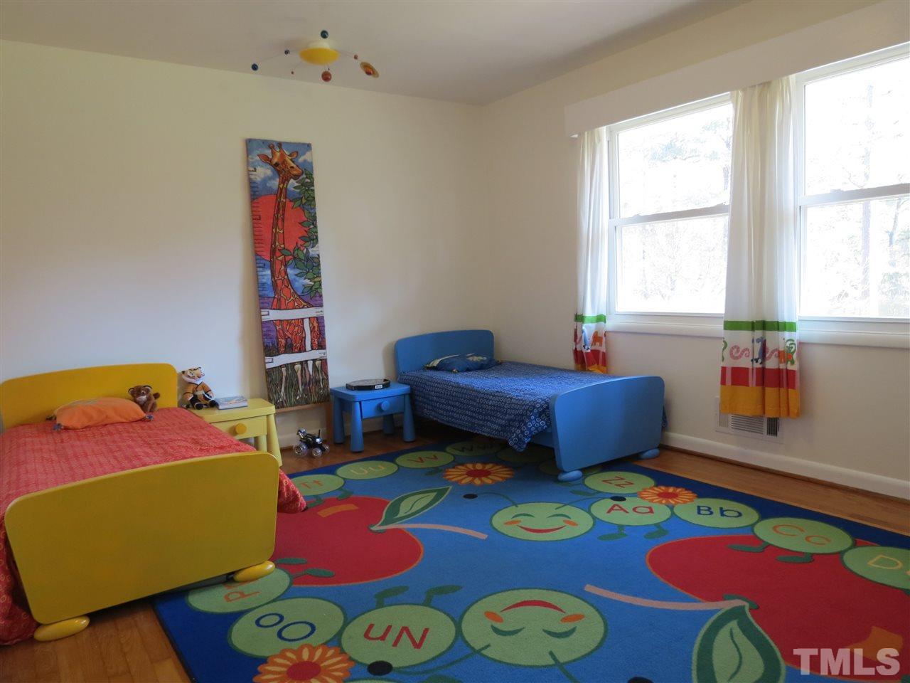 212 Bayleaf Drive Raleigh, NC 27615 - Photo 17 of 25 a room with furniture and a window