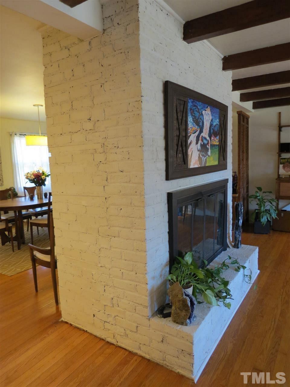 212 Bayleaf Drive Raleigh, NC 27615 - Photo 21 of 25 a living room with furniture and a fireplace