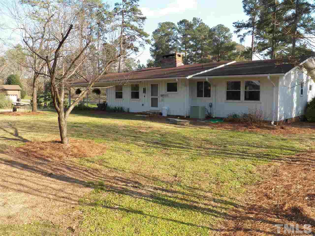 212 Bayleaf Drive Raleigh, NC 27615 - Photo 24 of 25 a front view of a house with a yard