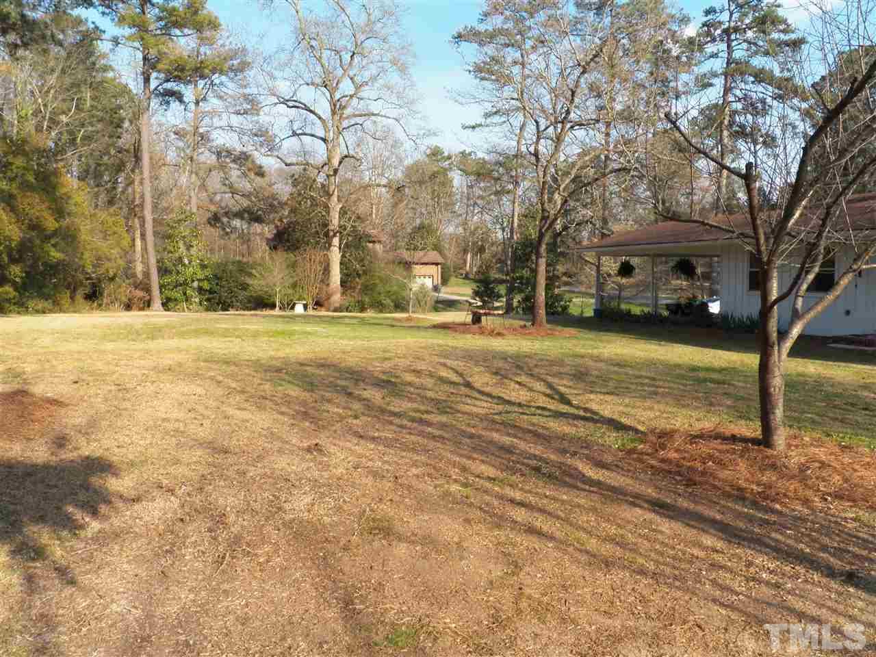 212 Bayleaf Drive Raleigh, NC 27615 - Photo 25 of 25 a front view of a house with a yard and trees