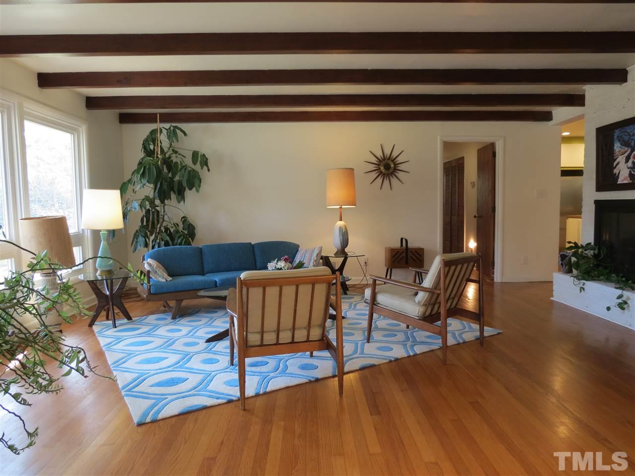 212 Bayleaf Drive Raleigh, NC 27615 - Photo 5 of 25 a living room with furniture and wooden floor