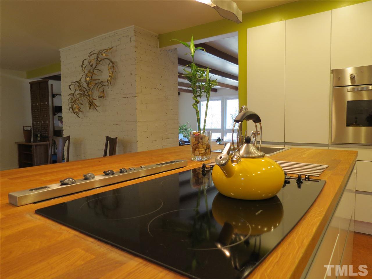 212 Bayleaf Drive Raleigh, NC 27615 - Photo 7 of 25 a view of a swimming pool kitchen