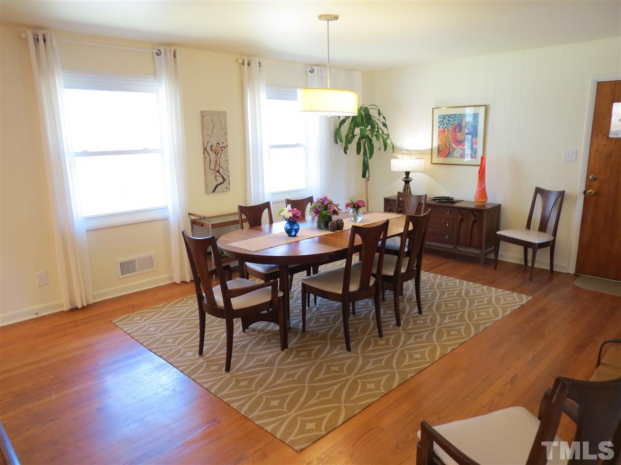 212 Bayleaf Drive Raleigh, NC 27615 - Photo 10 of 25 a view of a dining room with furniture and wooden floor