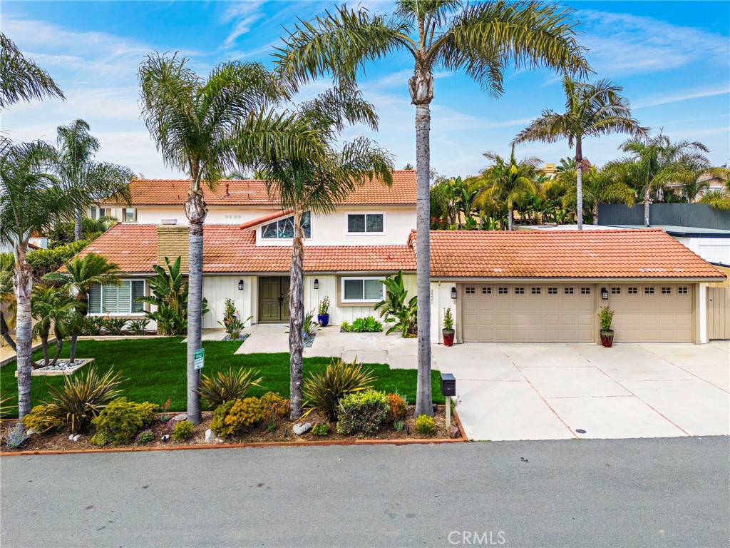 front view of a house with a garden