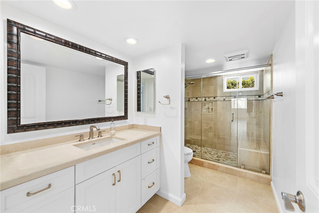 35491 Del Rey Dana Point, CA 92624 - Photo 15 of 48 a bathroom with a double vanity sink mirror and shower
