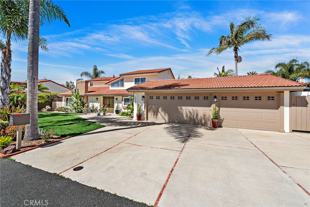35491 Del Rey Dana Point, CA 92624 - Photo 45 of 48 a front view of a house with a yard and potted plants