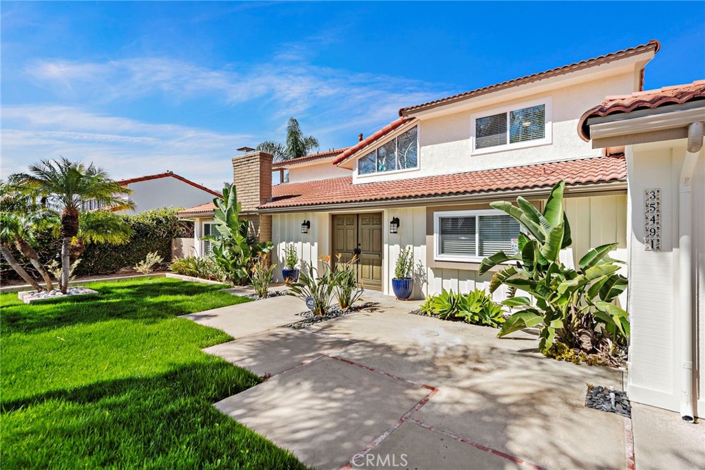 35491 Del Rey Dana Point, CA 92624 - Photo 48 of 48 a front view of a house with a yard and outdoor seating