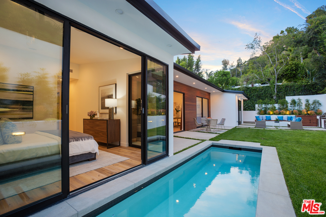2084 Roscomare Road Los Angeles, CA 90077 - Photo 1 of 22 a view of swimming pool with a patio