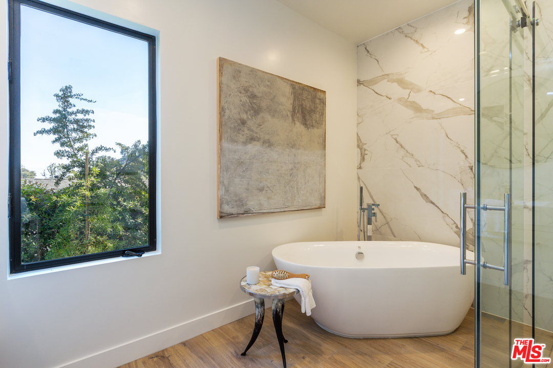 2084 Roscomare Road Los Angeles, CA 90077 - Photo 14 of 22 a bathroom with a bathtub and a shower