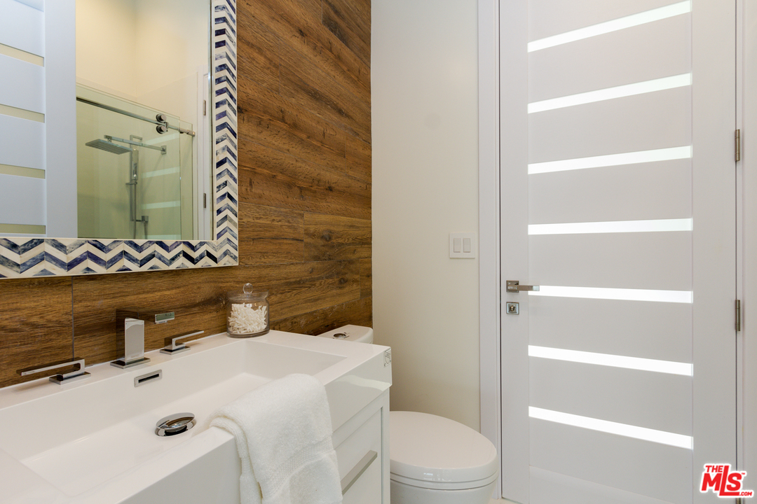 2084 Roscomare Road Los Angeles, CA 90077 - Photo 16 of 22 a bathroom with a sink toilet and shower