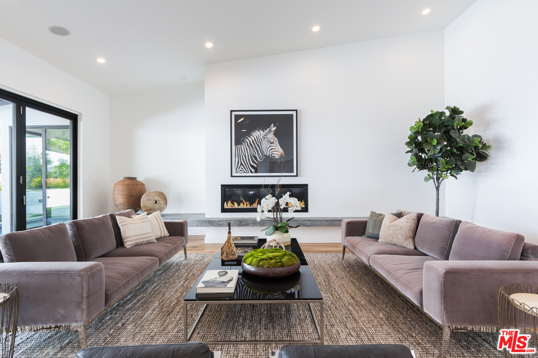 2084 Roscomare Road Los Angeles, CA 90077 - Photo 5 of 22 a living room with furniture and a couch