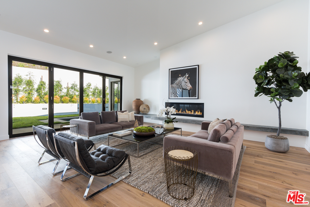 2084 Roscomare Road Los Angeles, CA 90077 - Photo 6 of 22 a living room with furniture and a large window