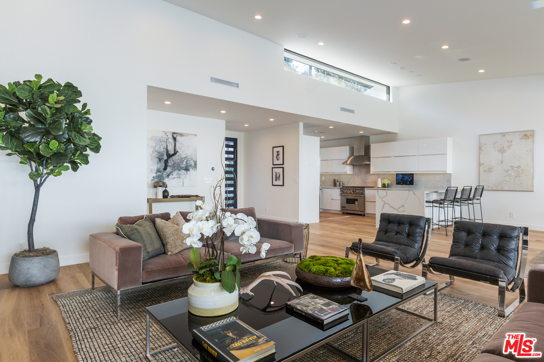 2084 Roscomare Road Los Angeles, CA 90077 - Photo 7 of 22 a living room with furniture and a table