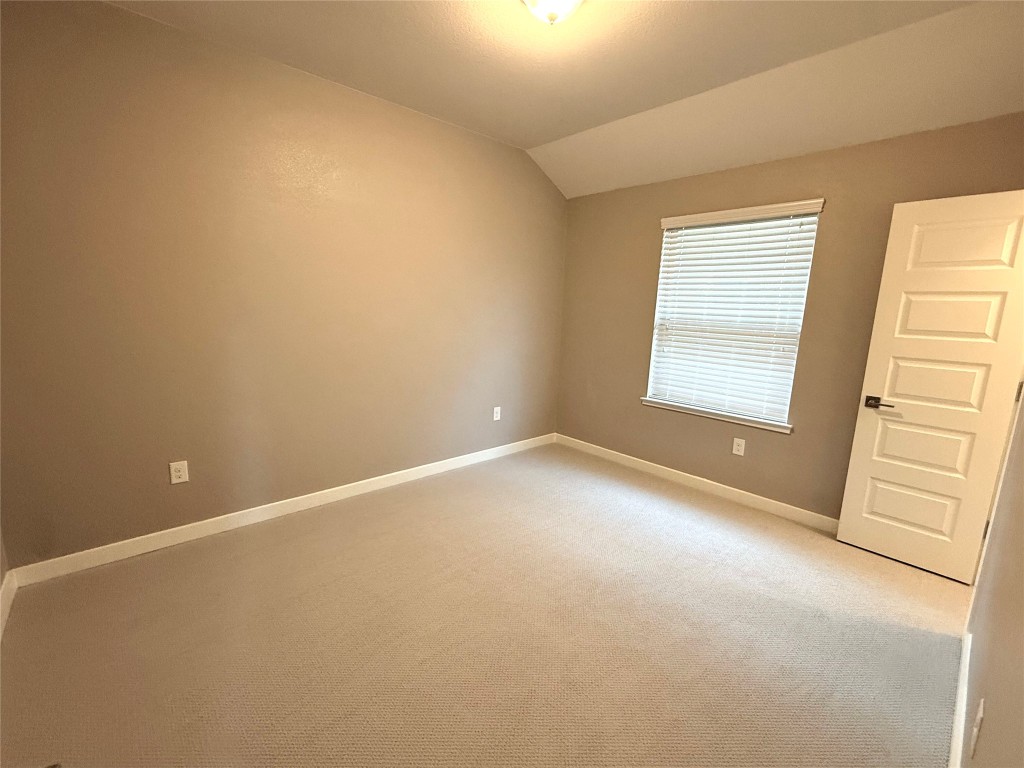 7216 Sienna Rouge Path Austin, TX 78744 - Photo 19 of 37 an empty room with windows