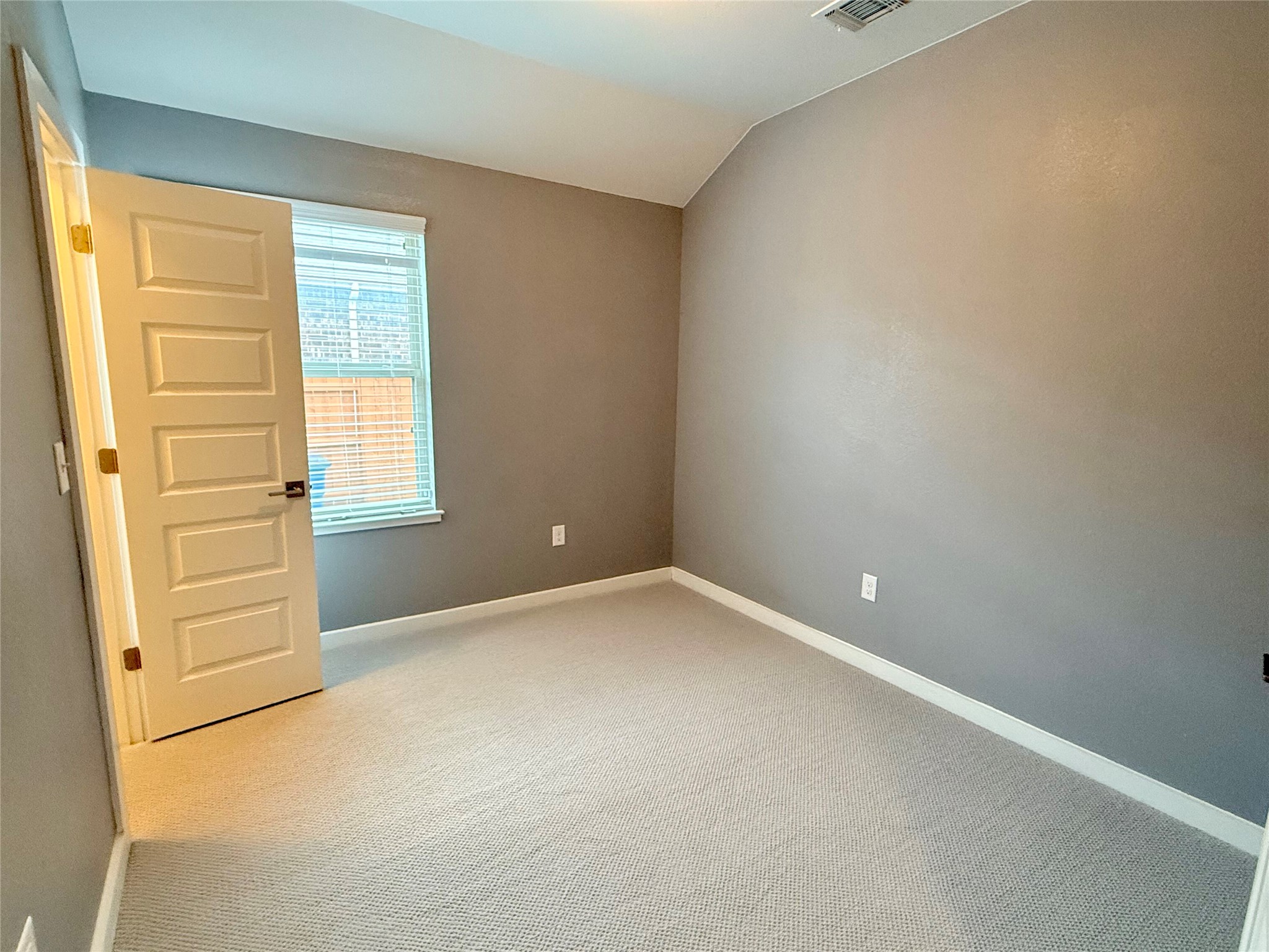 7216 Sienna Rouge Path Austin, TX 78744 - Photo 20 of 37 an empty room with windows