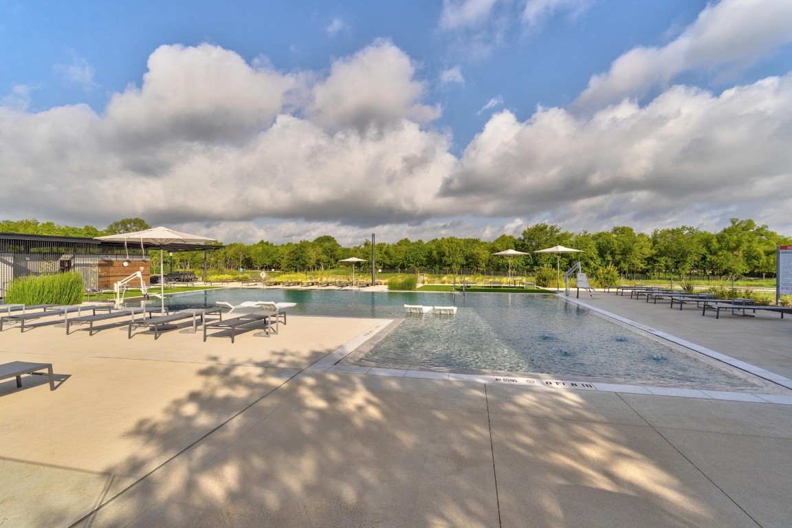 7216 Sienna Rouge Path Austin, TX 78744 - Photo 28 of 37 a view of a lake with a city