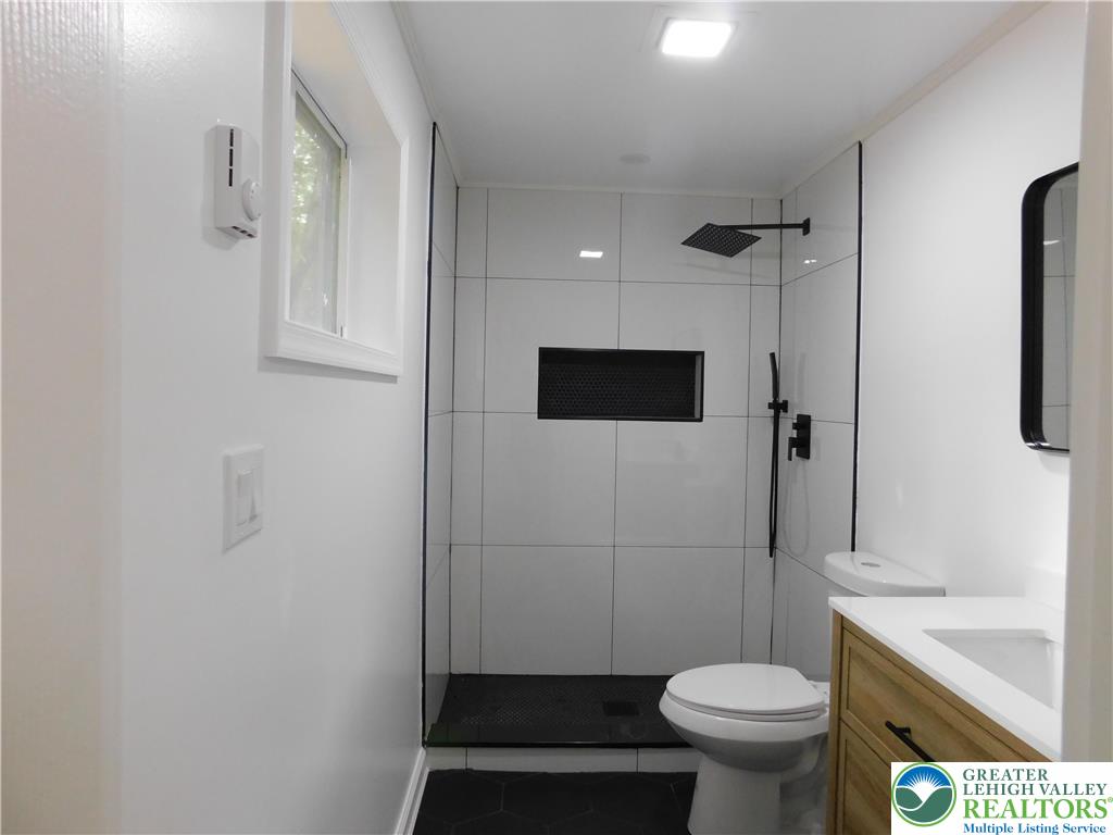 1405 Donalds Road Effort, PA 18330 - Photo 20 of 31 a bathroom with a sink toilet and shower