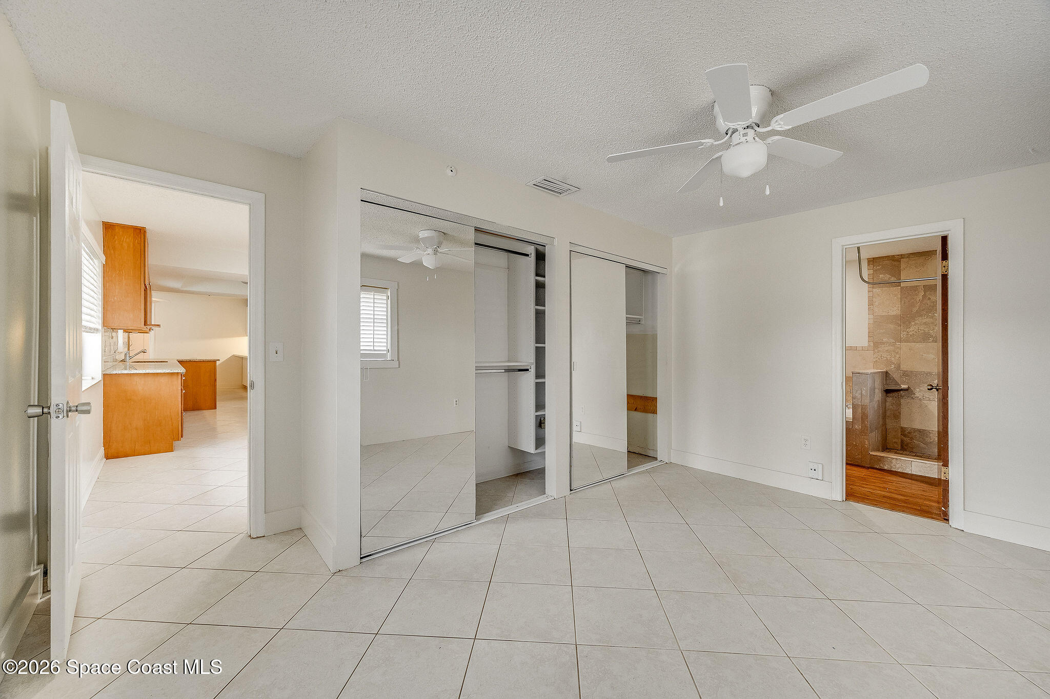2623 Reed Avenue Melbourne, FL 32901 - Photo 12 of 45 a view of a livingroom with a walk in closet and bedroom view