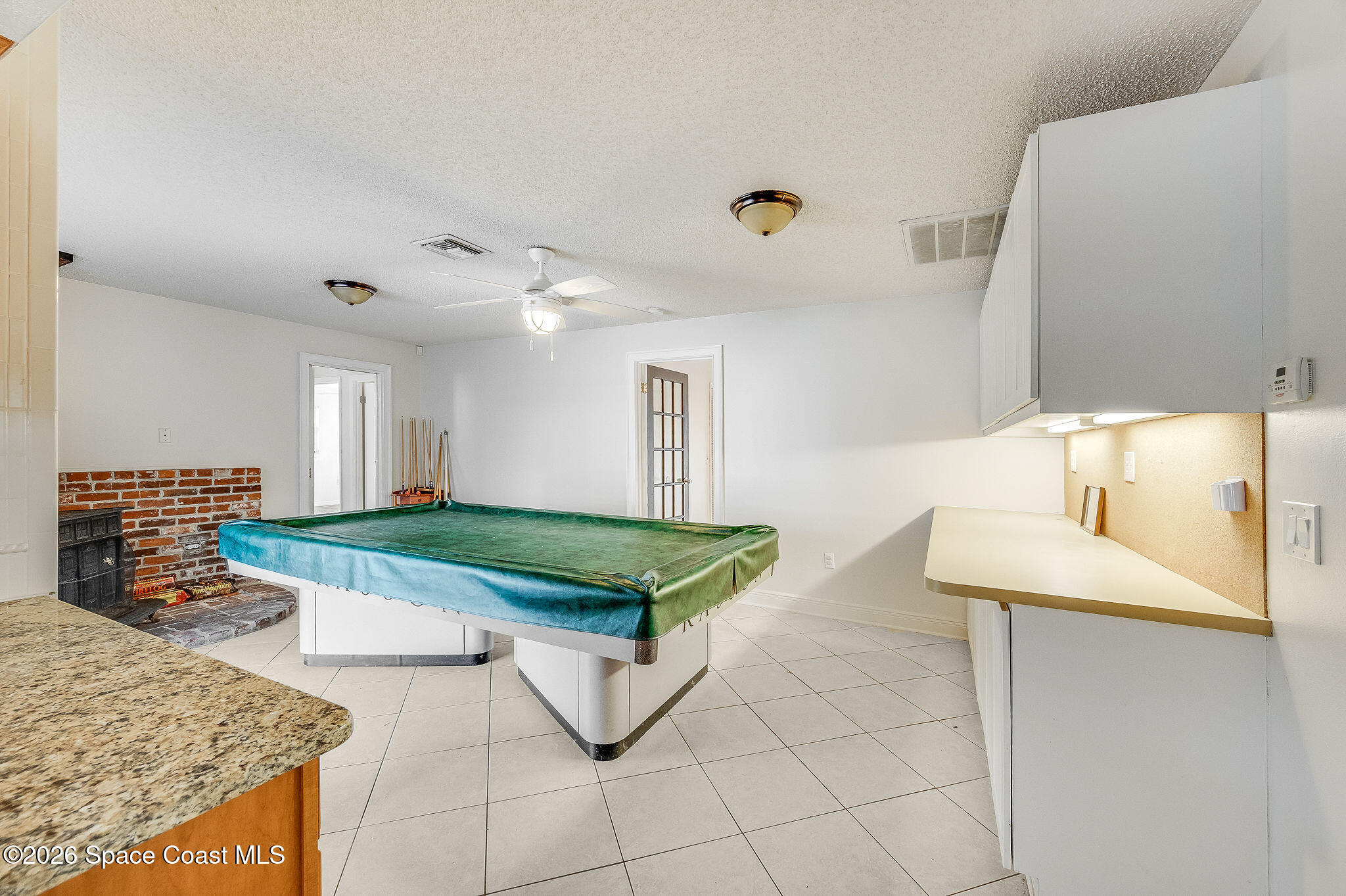 2623 Reed Avenue Melbourne, FL 32901 - Photo 19 of 45 a room with pool table and windows