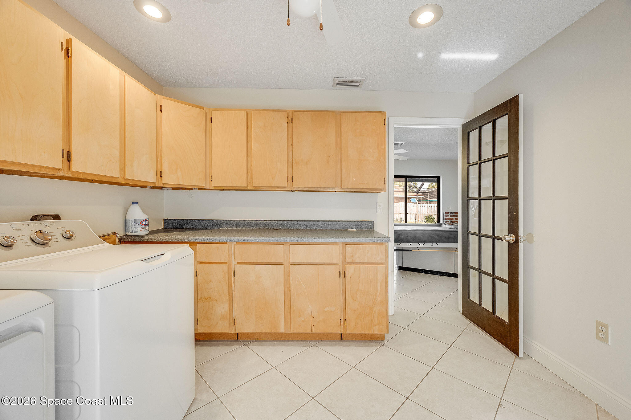 2623 Reed Avenue Melbourne, FL 32901 - Photo 20 of 45 a kitchen with stainless steel appliances granite countertop a refrigerator sink and cabinets