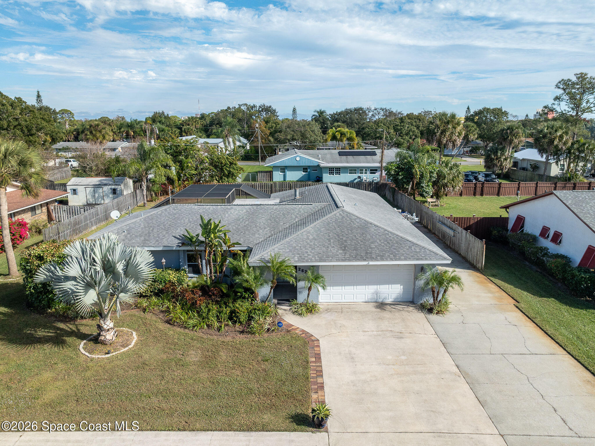 2623 Reed Avenue Melbourne, FL 32901 - Photo 2 of 45 a view of a swimming pool and a yard