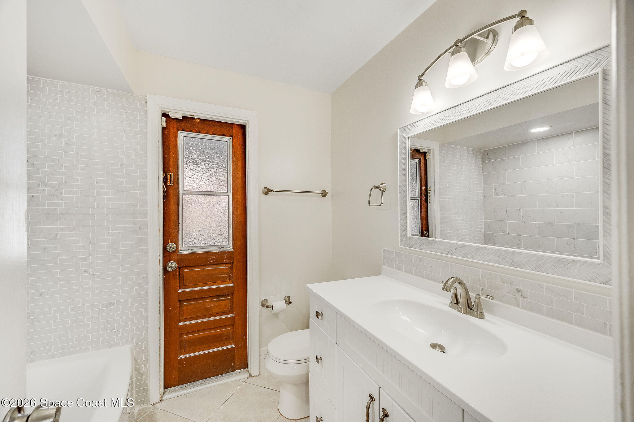 2623 Reed Avenue Melbourne, FL 32901 - Photo 21 of 45 a bathroom with a sink and a mirror