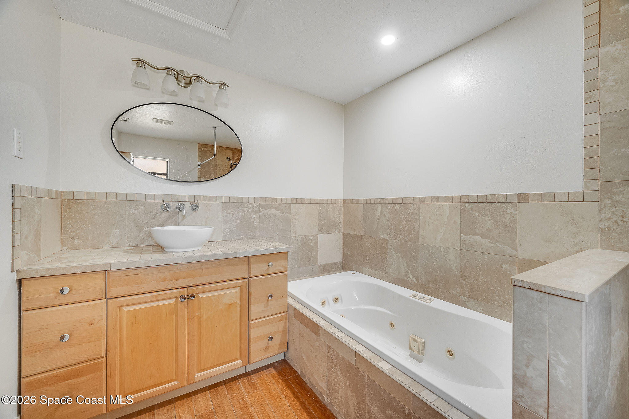 2623 Reed Avenue Melbourne, FL 32901 - Photo 25 of 45 a bathroom with a tub sink and mirror