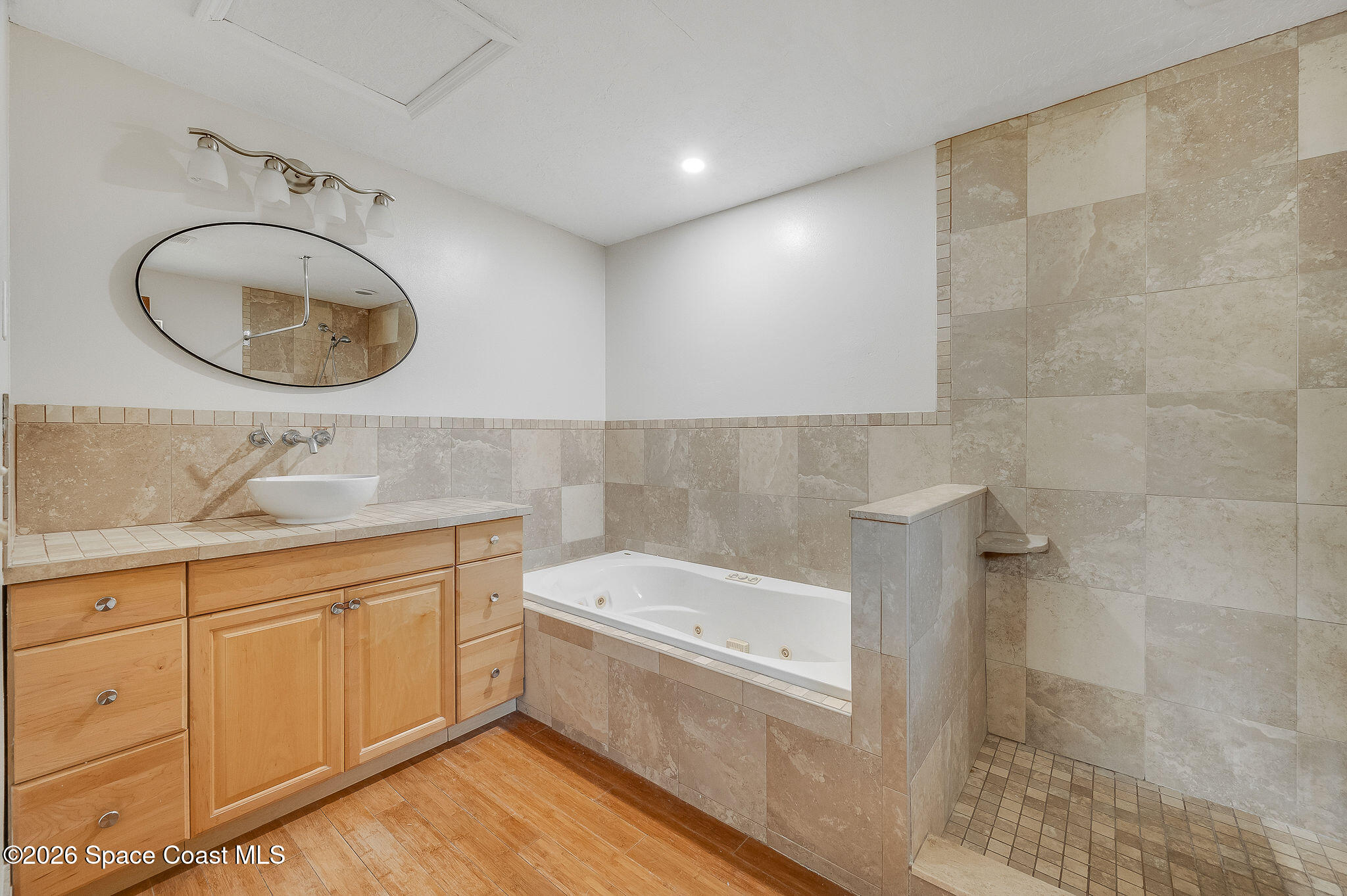 2623 Reed Avenue Melbourne, FL 32901 - Photo 26 of 45 a bathroom with a sink a vanity and a mirror