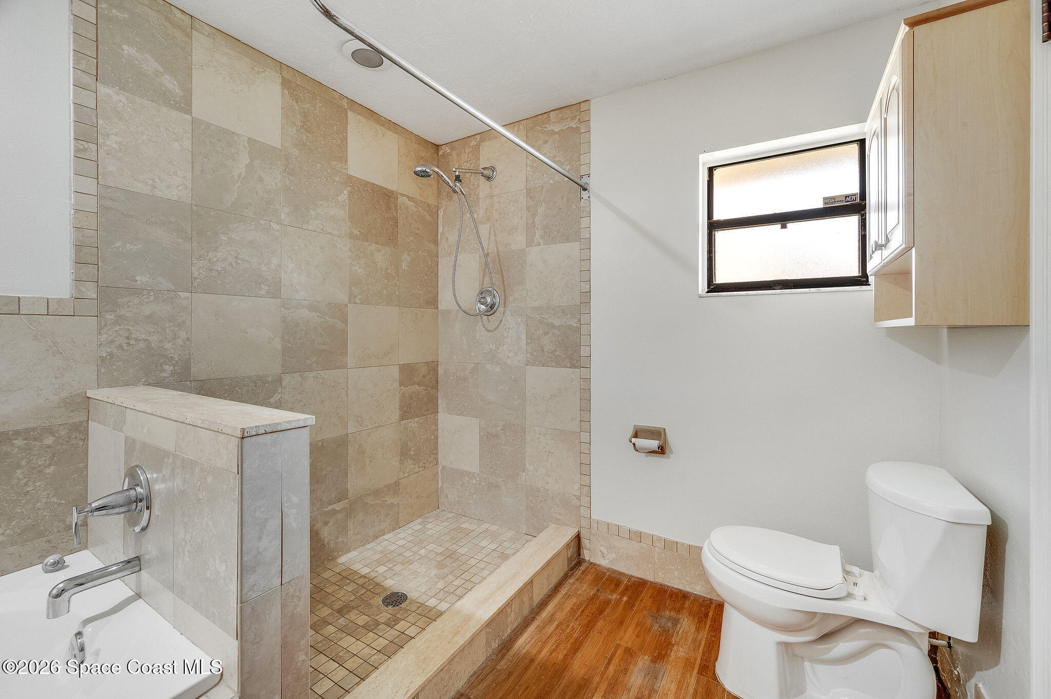 2623 Reed Avenue Melbourne, FL 32901 - Photo 27 of 45 a bathroom with a toilet and a shower