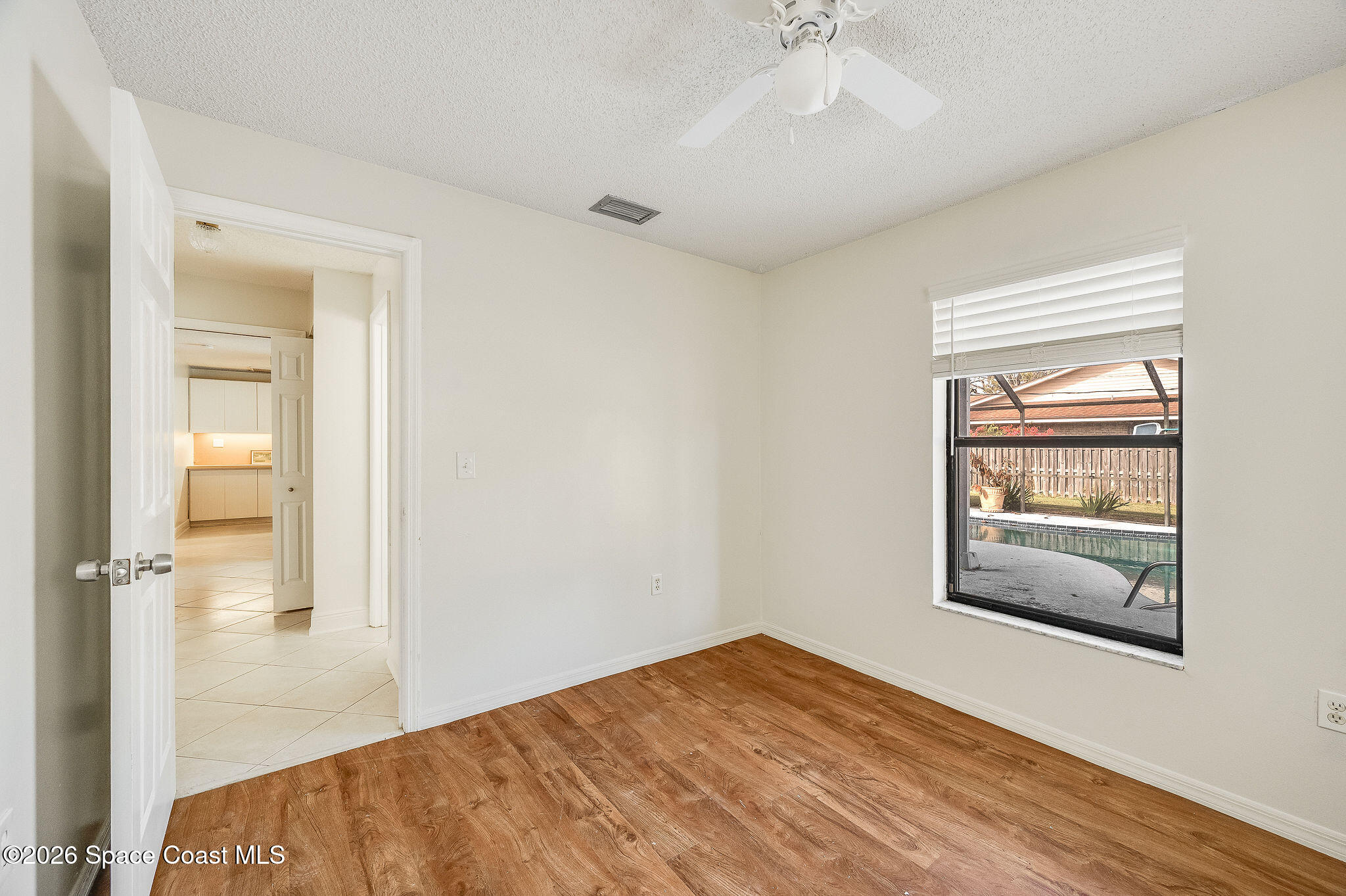 2623 Reed Avenue Melbourne, FL 32901 - Photo 28 of 45 a bedroom with a bed and a window