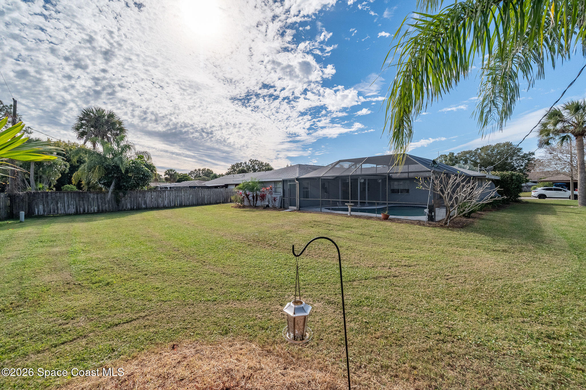 2623 Reed Avenue Melbourne, FL 32901 - Photo 29 of 45 a house view with swimming pool and tall trees