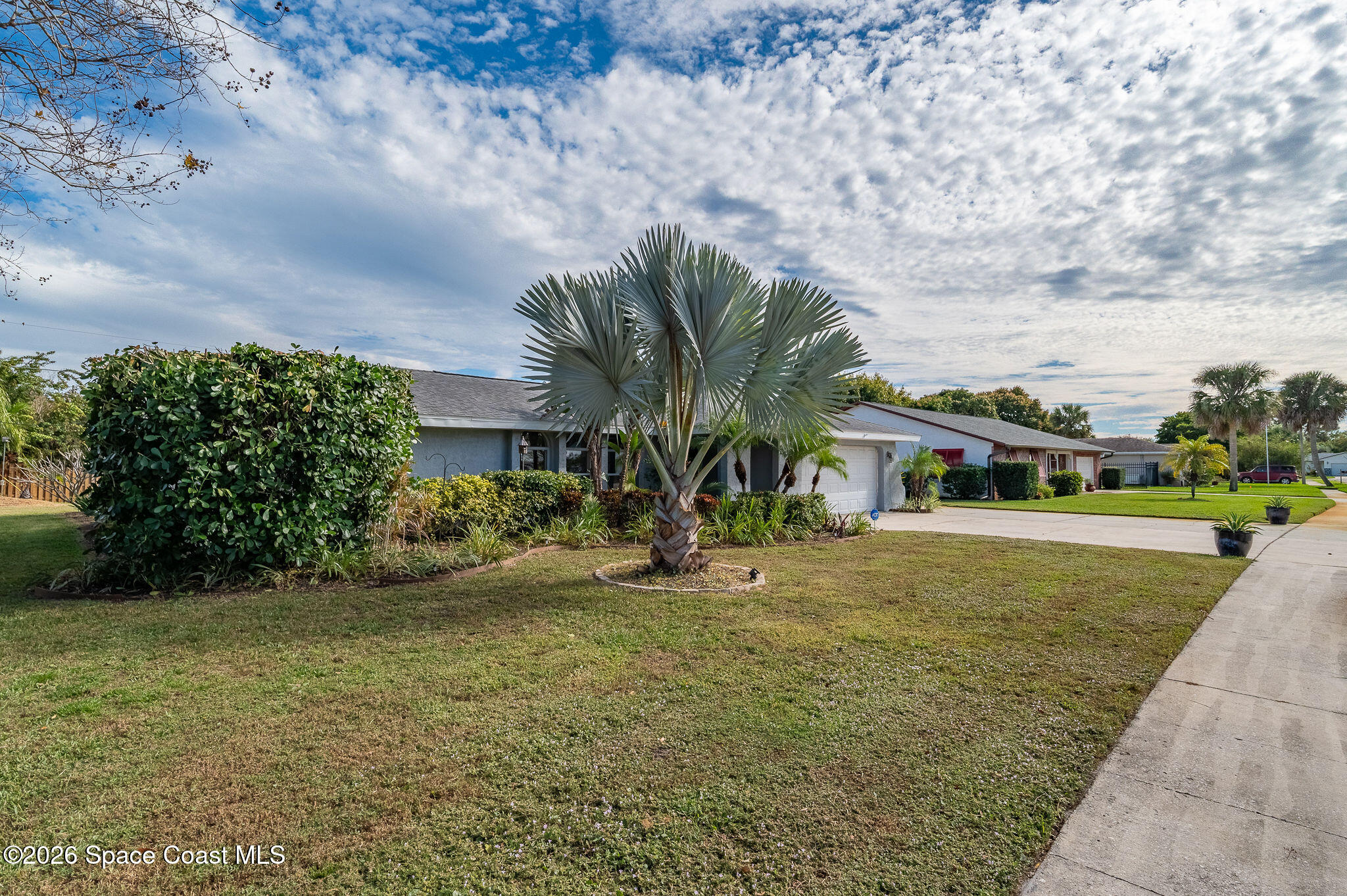 2623 Reed Avenue Melbourne, FL 32901 - Photo 37 of 45 a front view of a house with garden