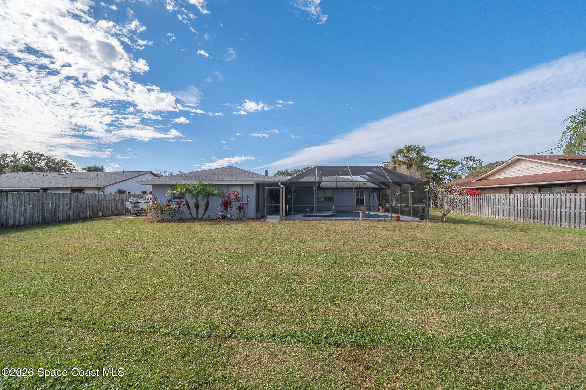 2623 Reed Avenue Melbourne, FL 32901 - Photo 40 of 45 a swimming pool with outdoor seating and yard