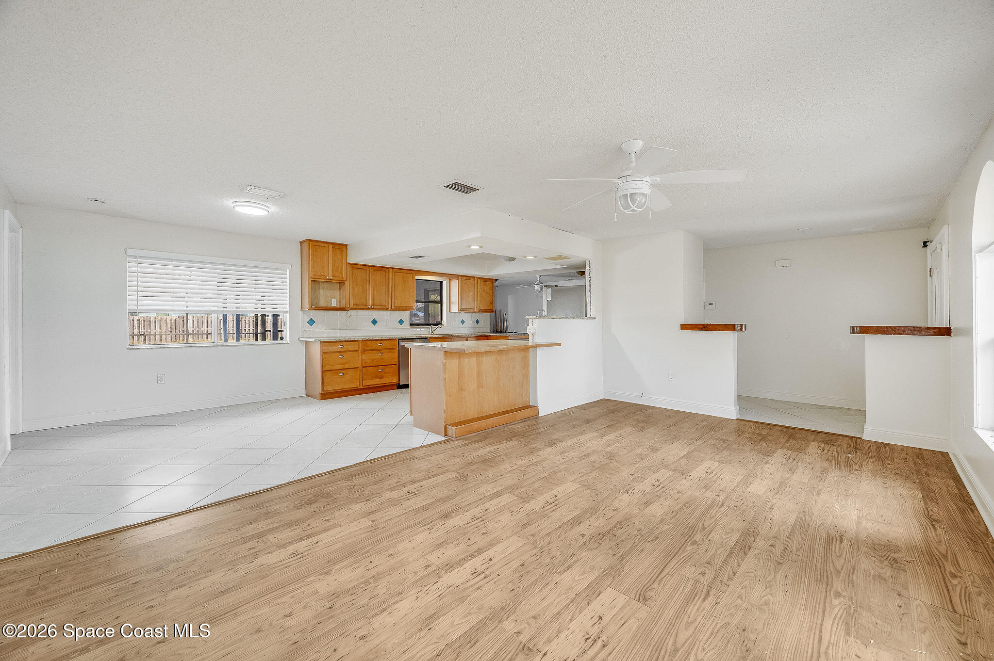 2623 Reed Avenue Melbourne, FL 32901 - Photo 8 of 45 a view of a kitchen with a sink and a refrigerator