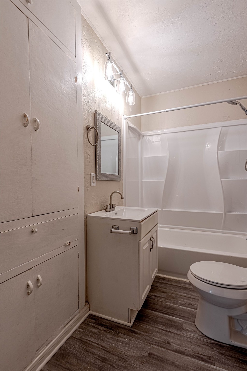 2538 Sycamore Avenue Huntsville, TX 77340 - Photo 19 of 31 a bathroom with a granite countertop sink toilet and shower