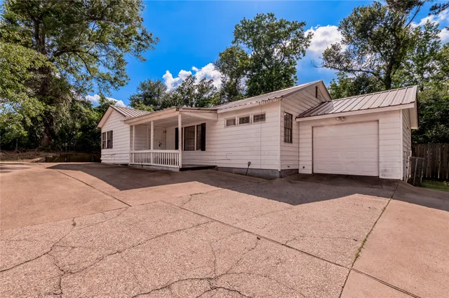 a front view of a house with a garage